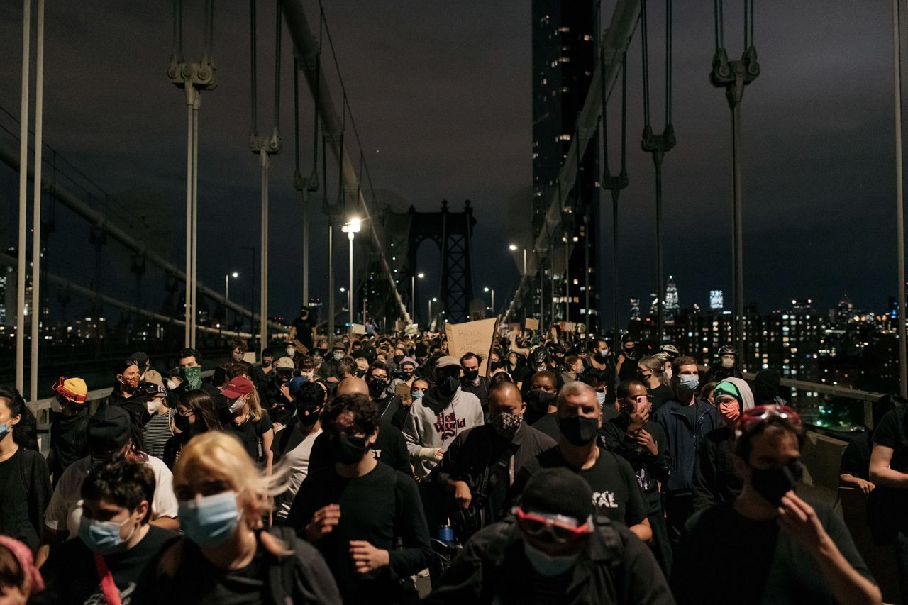 Protesters walk off the Manhattan Bridge in New York after being blocked by police on June 2. Police were on both sides of the bridge as peaceful protesters were in the middle. Eventually the protesters <a href=