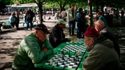 People play chess at a park in Stockholm on May 29, 2020, amid the coronavirus COVID-19 pandemic. - Sweden's two biggest opposition parties called Friday for an independent commission to be appointed within weeks to probe the country's response to the new coronavirus. (Photo by Jonathan NACKSTRAND / AFP) (Photo by JONATHAN NACKSTRAND/AFP via Getty Images)