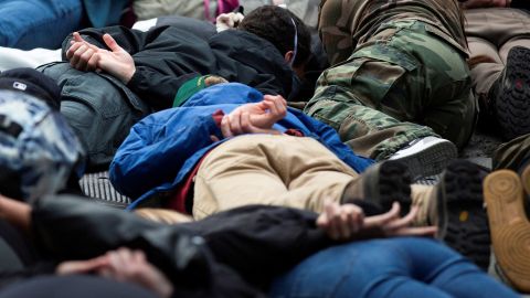 Protesters lie down in the position George Floyd was in when he died, during a rally in Seattle on Tuesday, June 2.