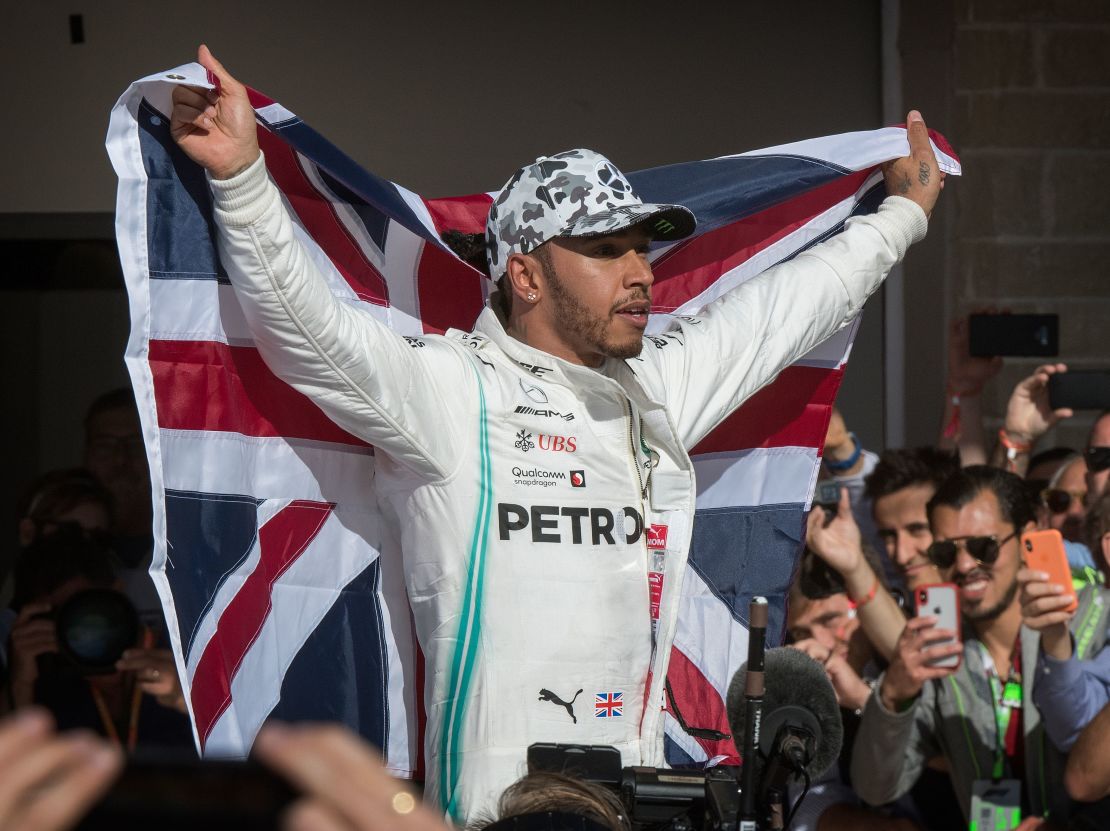 Lewis Hamilton celebrates being crowned F1 world champion last year. 