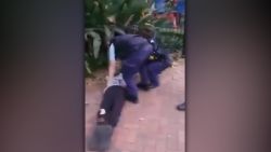 An Australian police officer trips and throws a 17-year-old Indigenous boy to the ground.