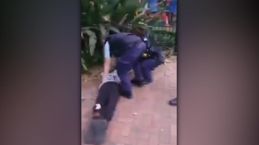 An Australian police officer trips and throws a 17-year-old Indigenous boy to the ground.