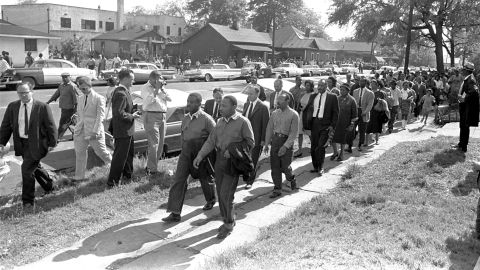 Rev. Ralph Abernathy and Rev. Martin Luther King Jr. lead a column of demonstrators as they attempt to march on Birmingham, Alabama, on April 12, 1963.