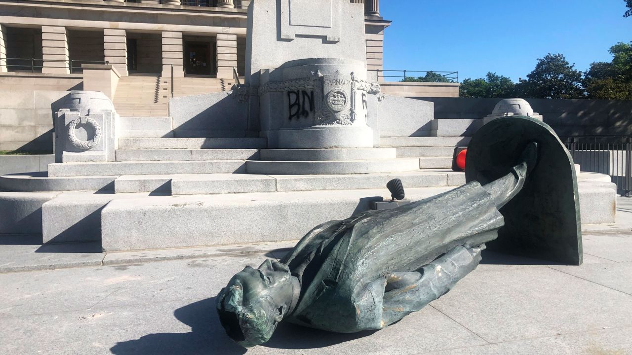 Protesters toppled the statue of Edward Carmack outside the state Capitol after a peaceful demonstration turned violent, Sunday, May 31, 2020, in Nashville, Tenn. 