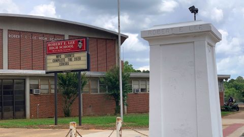 A pedestal that held a statue of Robert E. Lee stands empty outside a high school named for the Confederate general in Montgomery, Ala. on Tuesday, June 2, 2020.
