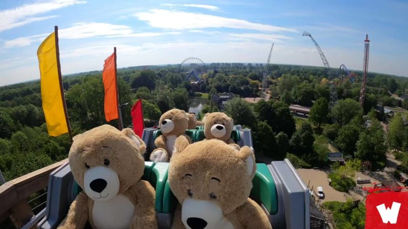 Why are these giant teddy bears riding a roller coaster