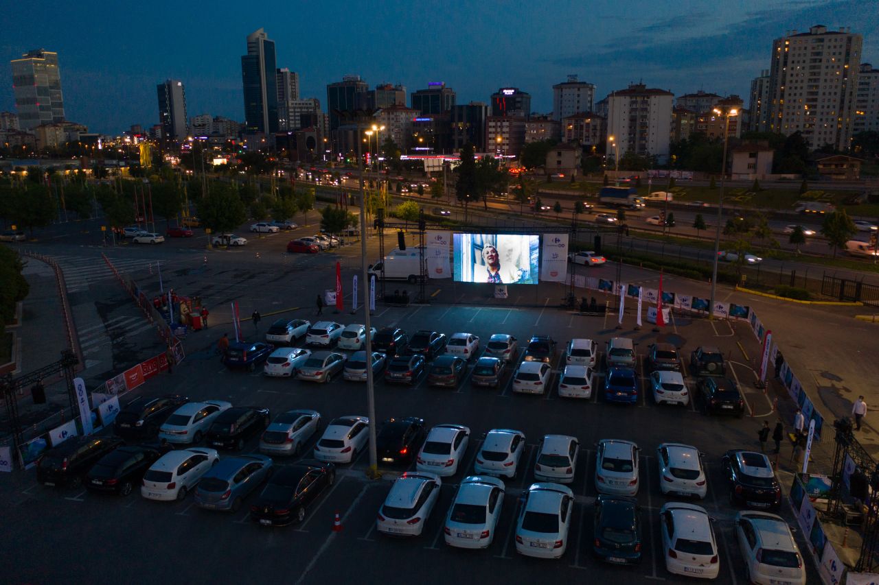 People watch a movie at a temporary drive-in movie theater in Istanbul on May 28.