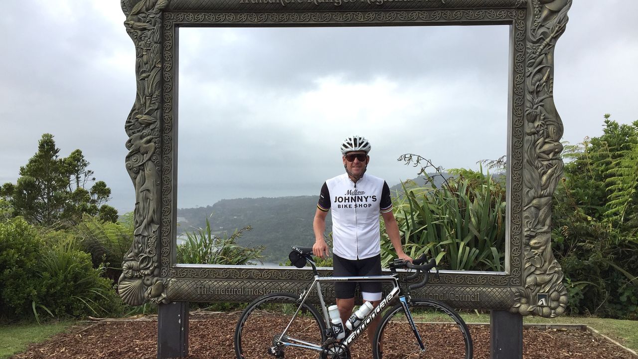Lance Armstrong poses for a photo at the Arataki Visitor Centre during a ride with local cyclists in Auckland's Waitakere Ranges on December 19, 2016 in Auckland, New Zealand.