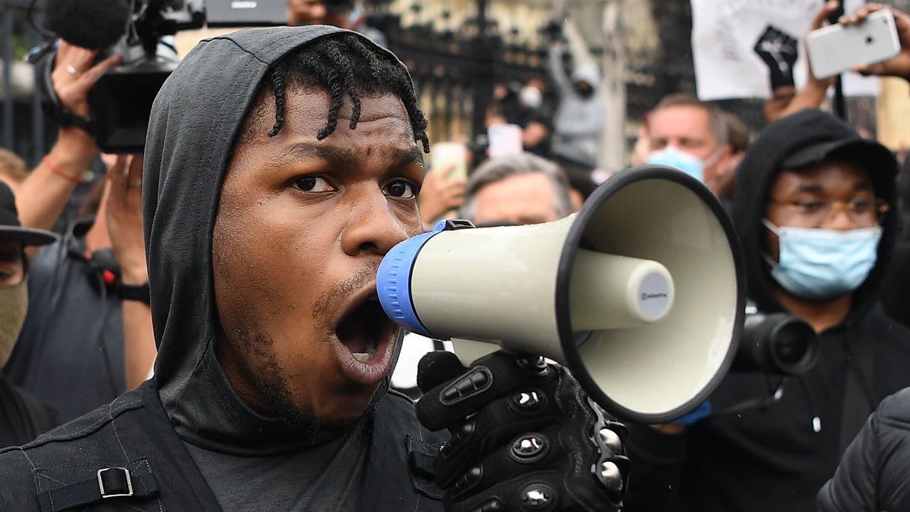 British actor John Boyega speaks to protestors in Parliament square during an anti-racism demonstration in London, on June 3, 2020, after George Floyd, an unarmed black man died after a police officer knelt on his neck during an arrest in Minneapolis, USA. - Londoners defied coronavirus restrictions and rallied on Wednesday in solidarity with protests raging across the United States over the death of George Floyd, an unarmed black man who died during an arrest on May 25. (Photo by DANIEL LEAL-OLIVAS / AFP) (Photo by DANIEL LEAL-OLIVAS/AFP via Getty Images)