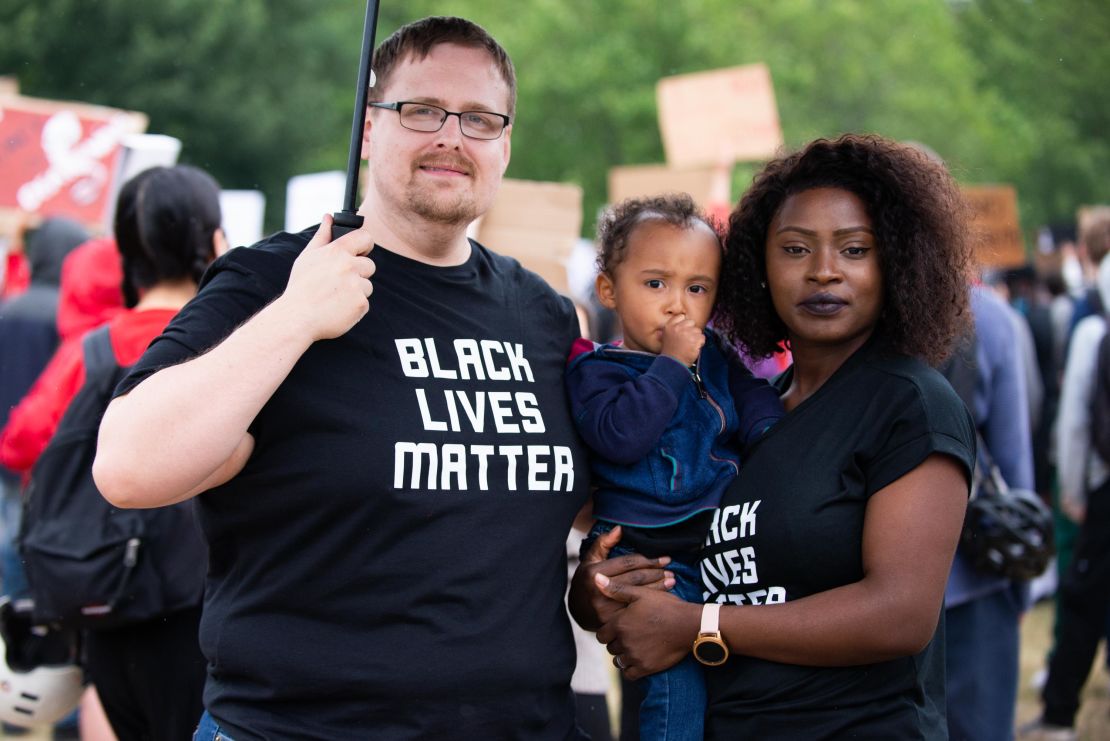 Happy Idehen Hill, from right, with her son, Xander, and husband, Alex Hill.