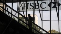 The silhouette of a person riding on an escalator is seen at the HSBC Holdings Plc headquarters building in the Central district of Hong Kong, China, on Monday, April 27, 2020. HSBC is scheduled to release first-quarter earnings results on April 28. Photographer: Roy Liu/Bloomberg via Getty Images