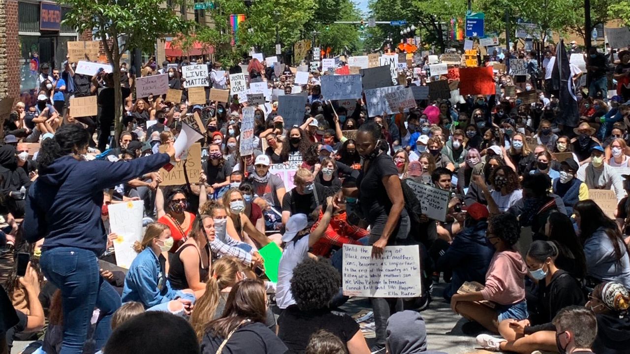 Ryan Jones and his 15-year-old son attended a crowded demonstration in State College, Pennsylania.