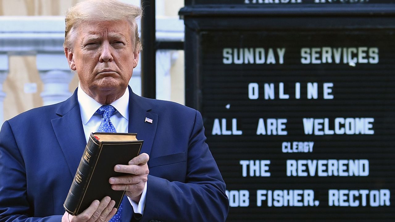 US President Donald Trump holds up a Bible outside of St John's Episcopal church across Lafayette Park in Washington.