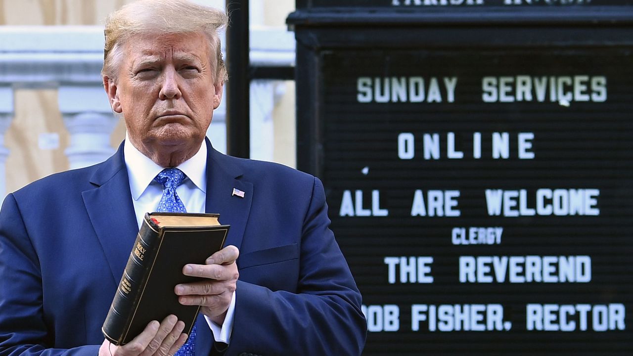 President Donald Trump holds up a Bible outside of St John's Episcopal church across Lafayette Park in Washington on June 1, 2020.