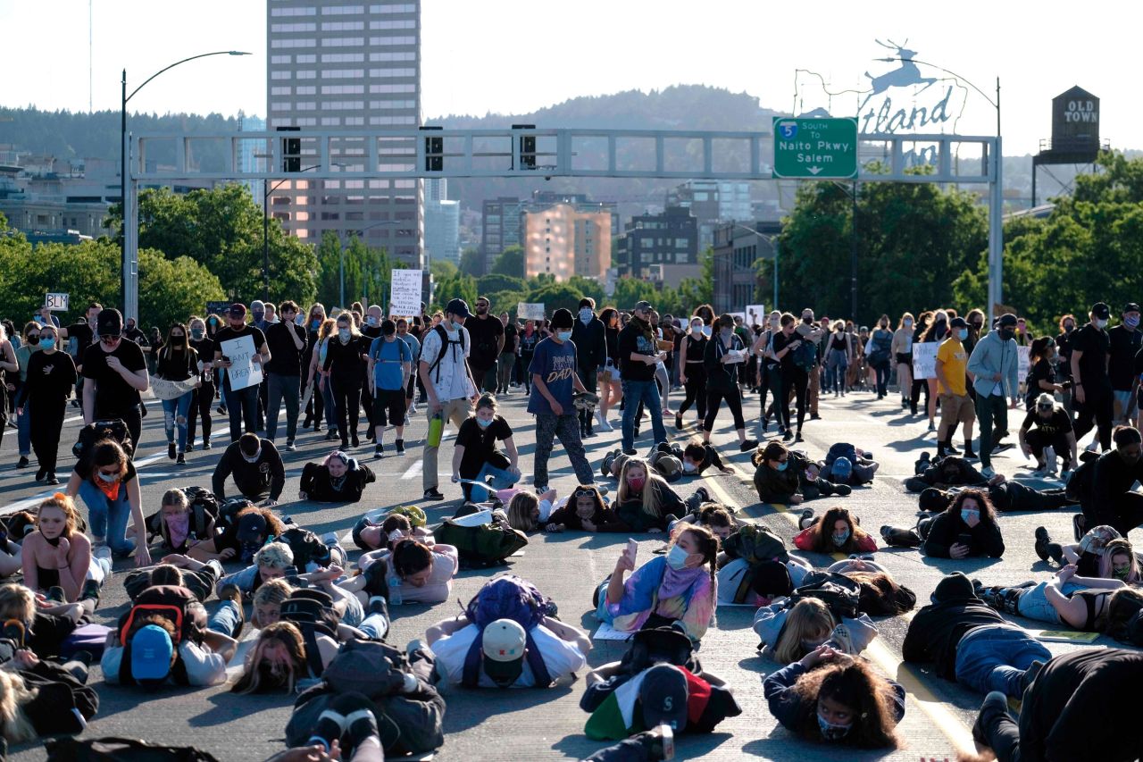 Protesters lie down on the Burnside Bridge in Portland, Oregon, on Monday.