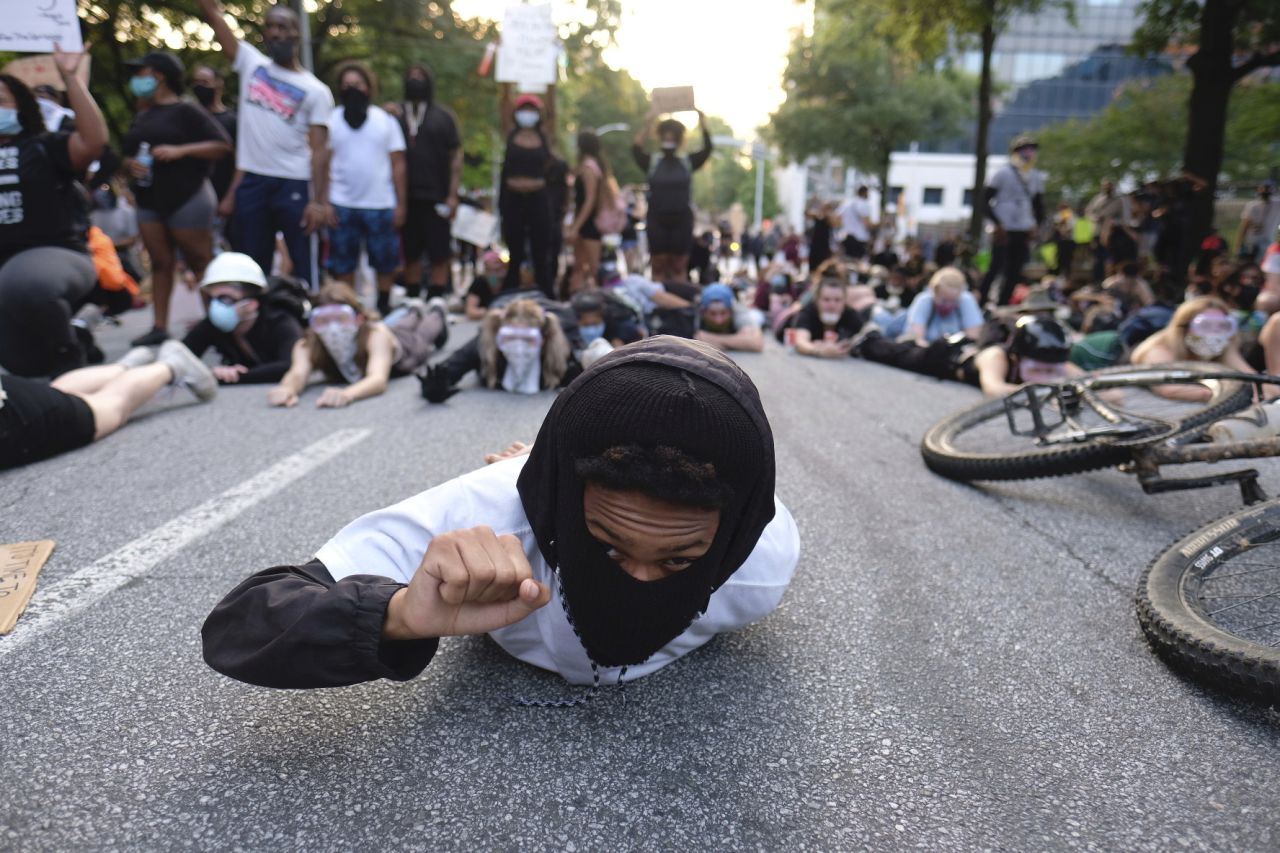 Protesters lie down during a demonstration in Atlanta on Monday.