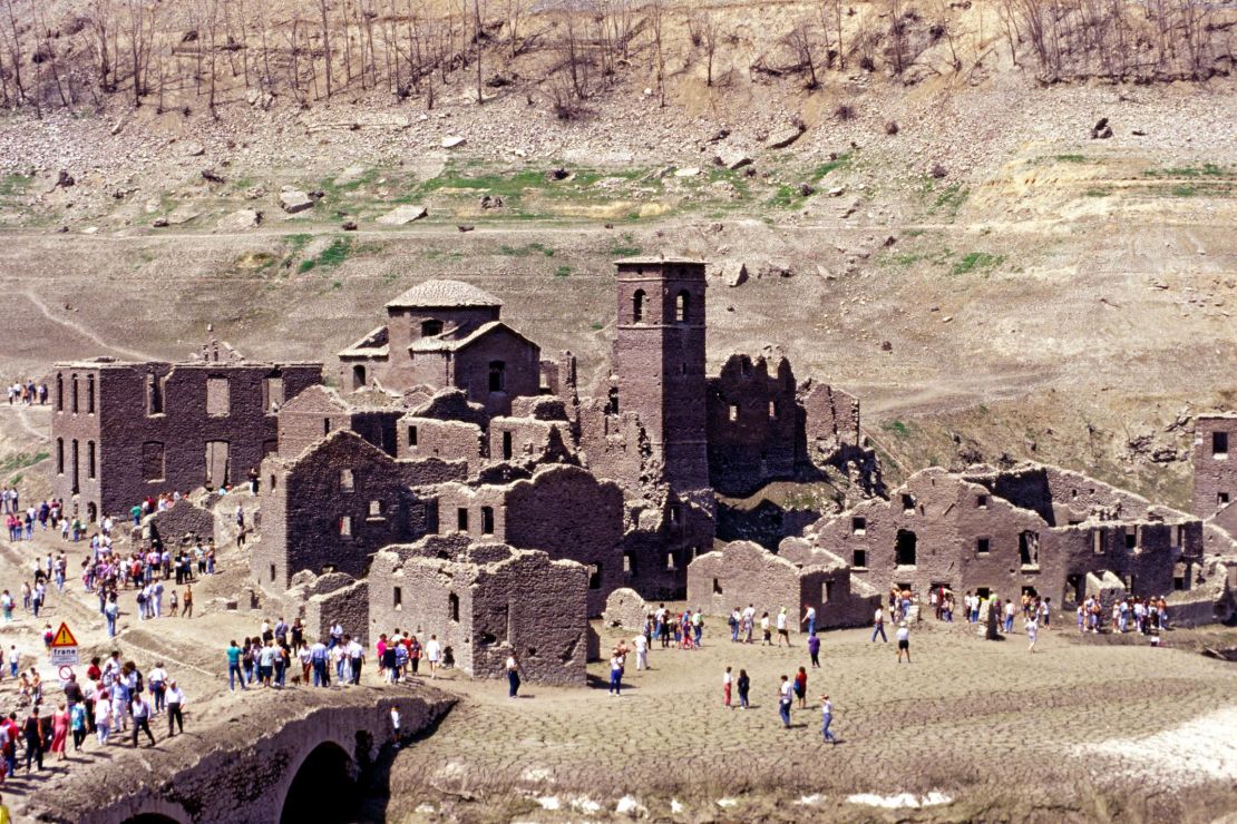 The ruins of the abandoned village sometimes see the light of day when the lake is drained.