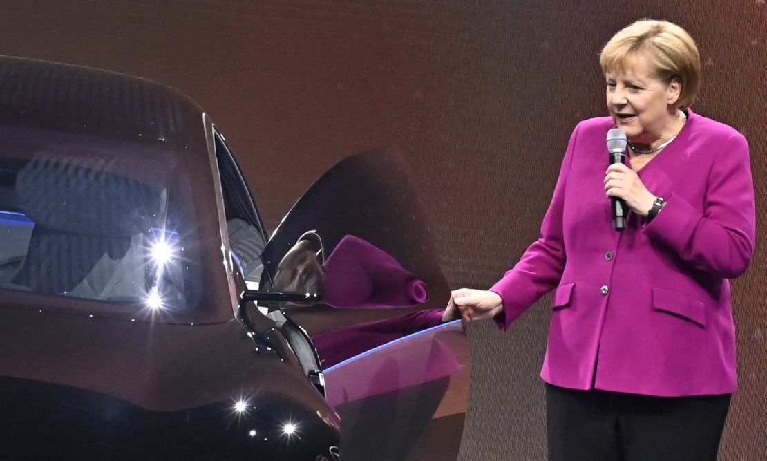 German Chancellor Angela Merkel pictured next to an electric Mercedes in 2019.