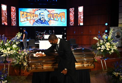 Floyd's casket is wiped down in the sanctuary hours before the service.