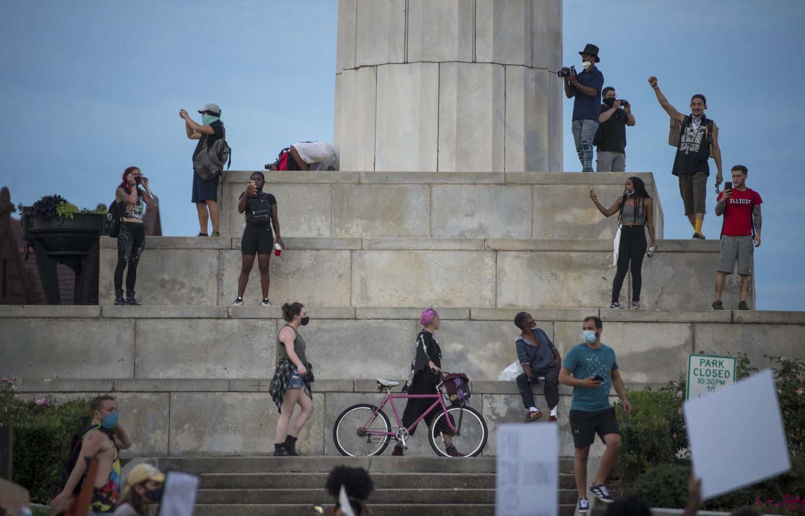 Protesters in New Orleans gather in front of a pedestal that once displayed a statue of Confederate soldier Robert E. Lee. The Civil War-era landmark <a href="index.php?page=&url=https%3A%2F%2Fedition.cnn.com%2F2017%2F05%2F19%2Fus%2Fnew-orleans-confederate-monuments%2Findex.html" target="_blank">was removed in 2017</a> after a nationwide debate over Confederate symbols.