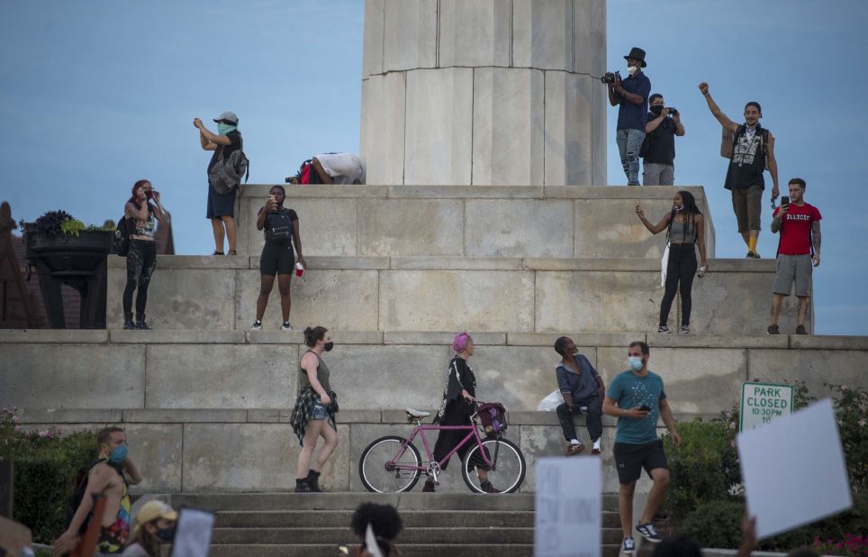 Protesters in New Orleans gather in front of a pedestal that once displayed a statue of Confederate soldier Robert E. Lee. The Civil War-era landmark <a href="https://edition.cnn.com/2017/05/19/us/new-orleans-confederate-monuments/index.html" target="_blank">was removed in 2017</a> after a nationwide debate over Confederate symbols.