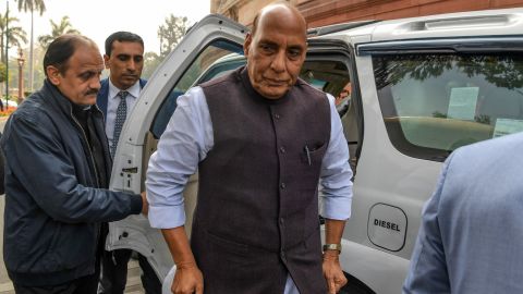 India's Defence Minister Rajnath Singh (C) arrives at the Parliament in New Delhi on February 11.