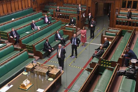 Lawmakers from the House of Commons <a href="https://twitter.com/HoCPress/status/1267892279823515651" target="_blank" target="_blank">observe social-distancing rules</a> as they cast votes in London on Tuesday, June 2.