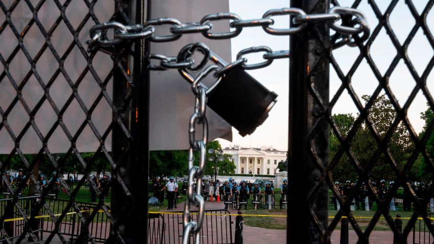 A locked padlock keeps a metal fence recently erected in front of the White House and meant to keep protestors at bay closed on June 2, 2020.