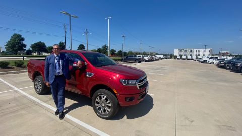 Brian Huth of Sam Pack's Five Star Ford in Texas stands next to one of the few Ford Rangers he has left to sell.