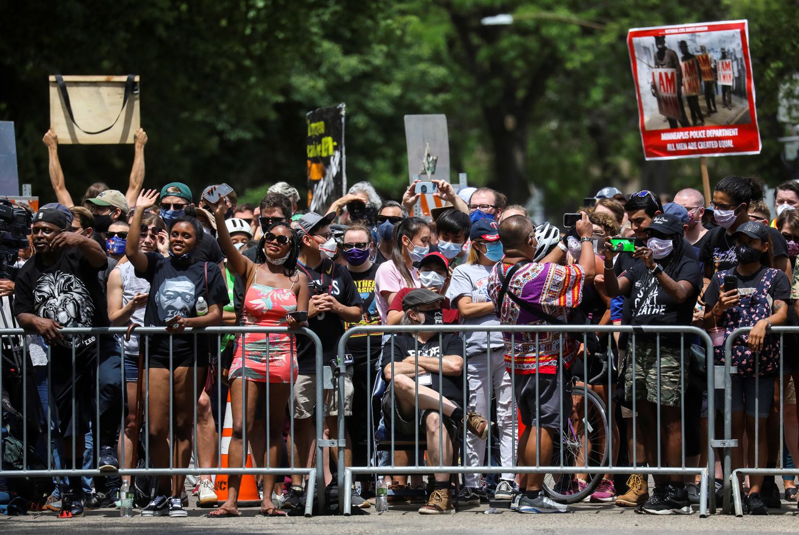 People stand outside to show their support during Floyd's service in Minneapolis.