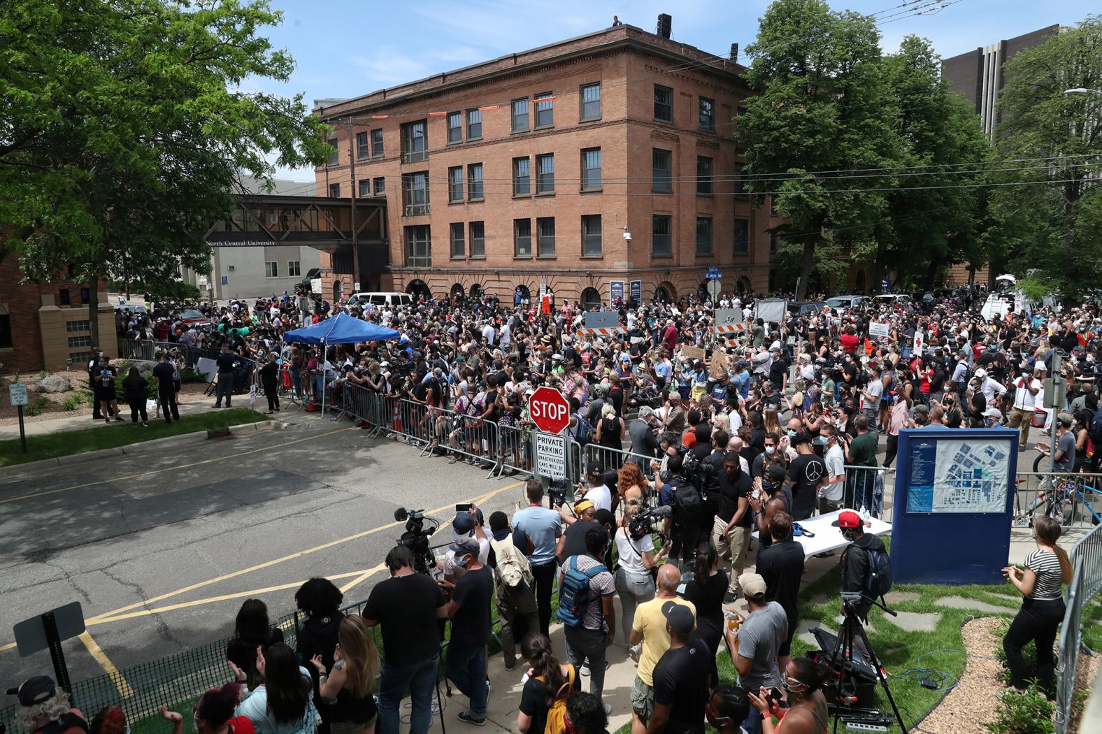 People gather outside the service.