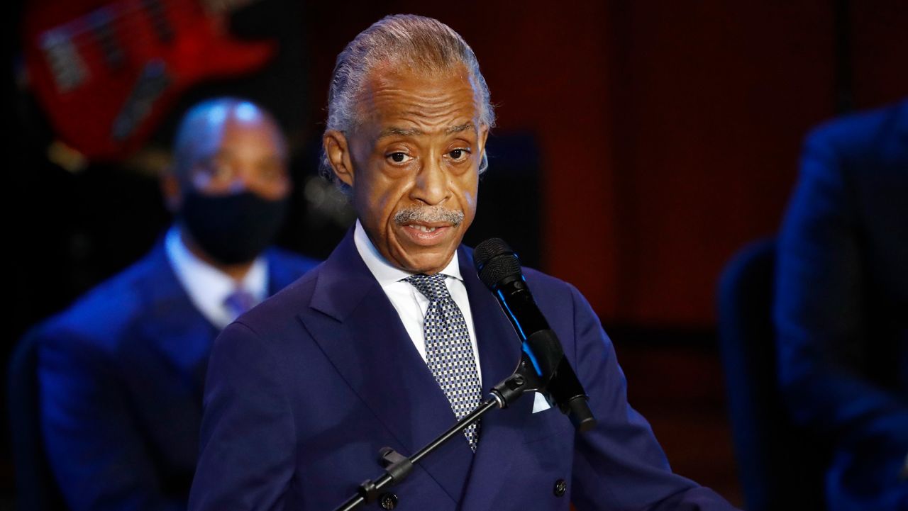 The Rev. Al Sharpton speaks at a memorial service for, George Floyd at North Central University Thursday, June 4, 2020, in Minneapolis. (AP Photo/Julio Cortez)