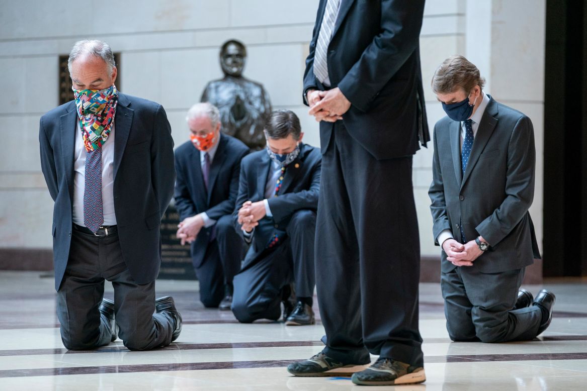 Democratic senators take a knee as they observe a moment of silence at the US Capitol on Thursday, June 4.