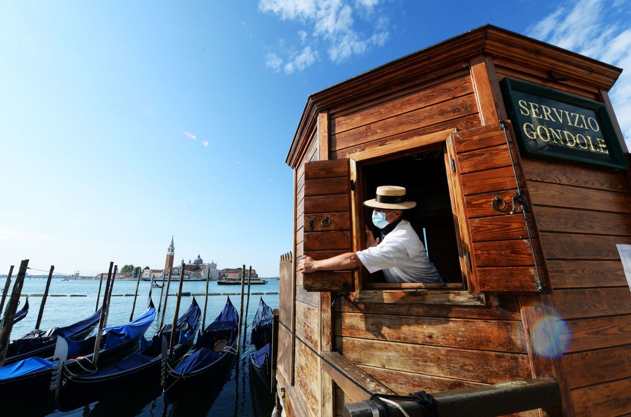 A gondoliere opens a kiosk for people wanting to go for a gondola ride in May.