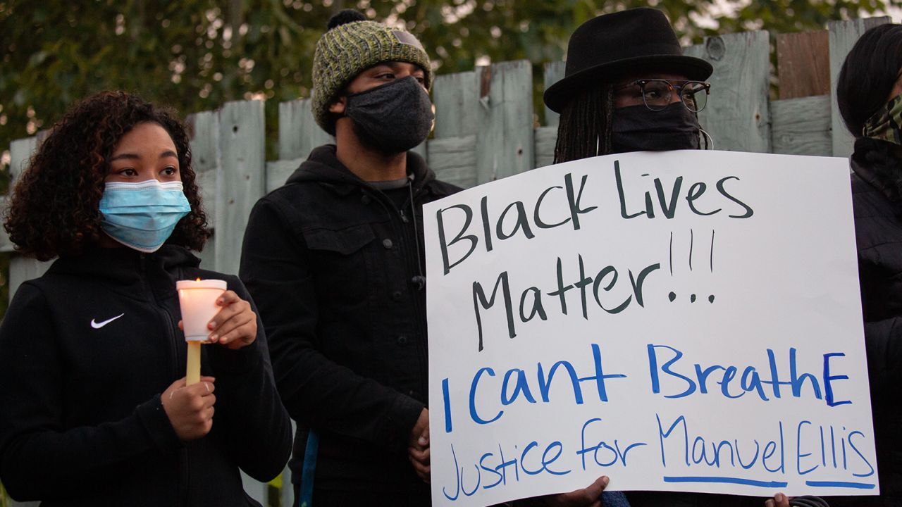 TACOMA, WA - JUNE 03: People listen during a vigil for Manuel Ellis, a black man whose March death while in Tacoma Police custody was recently found to be a homicide, according to the Pierce County Medical Examiners Office, near the site of his death on June 3, 2020 in Tacoma, Washington. Protests and other events sparked by the death of George Floyd have continued in the Tacoma area after the Medical Examiner found that the cause of death in the Manuel Ellis case was caused by respiratory arrest due to hypoxia due to physical restraint. (Photo by David Ryder/Getty Images)