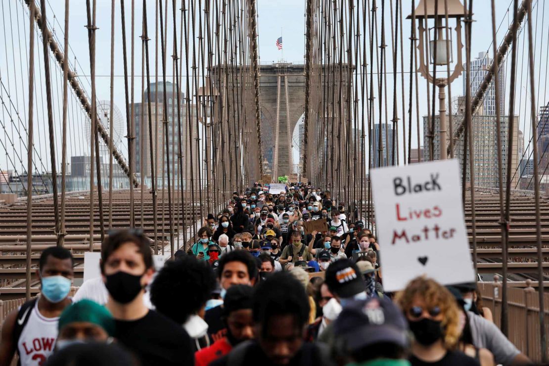 Demonstrators march across Brooklyn Bridge  on June 4, 2020