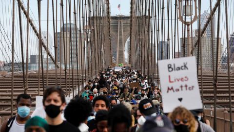 Demonstrators march across Brooklyn Bridge  on June 4, 2020