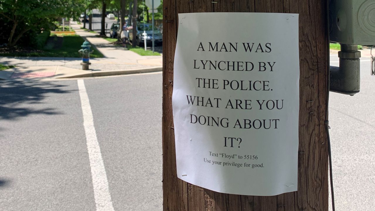 A man and two women were posting flyers in support of Black Lives Matter when the man charged them, according to a release.