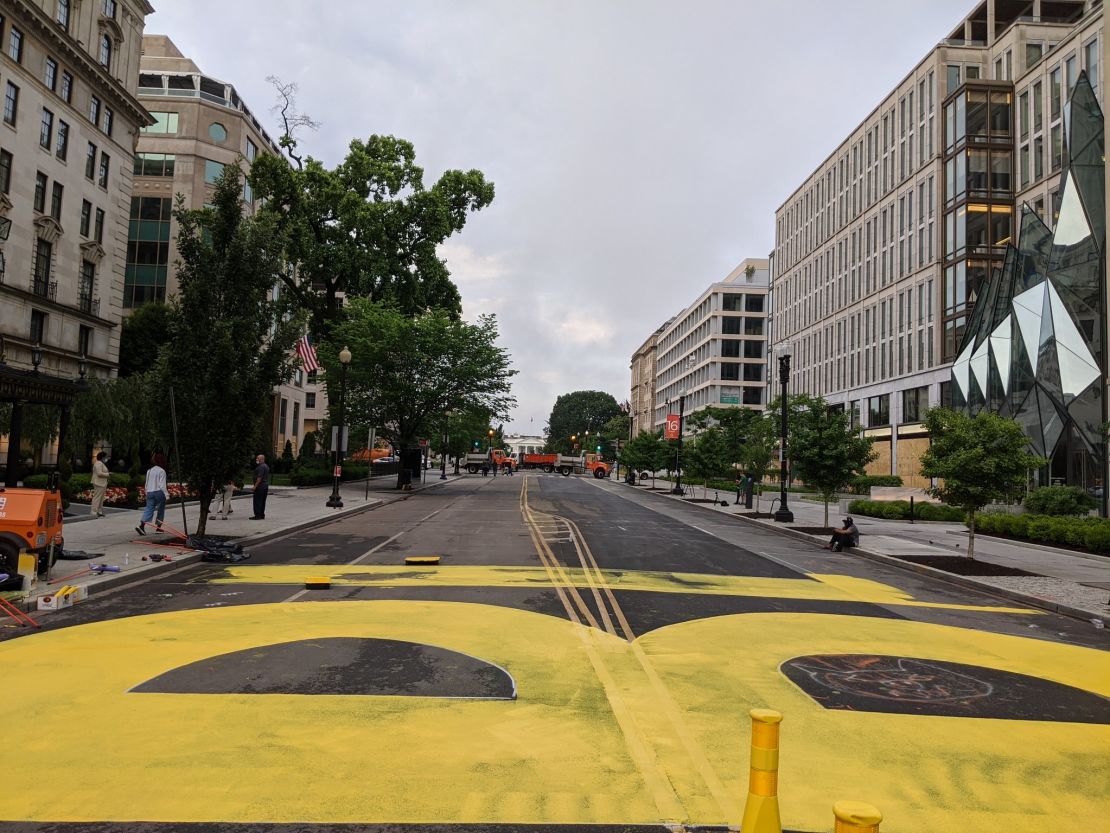 City workers began painting "black lives matter" in yellow paint on Friday on 16th Street in Washington, D.C.
