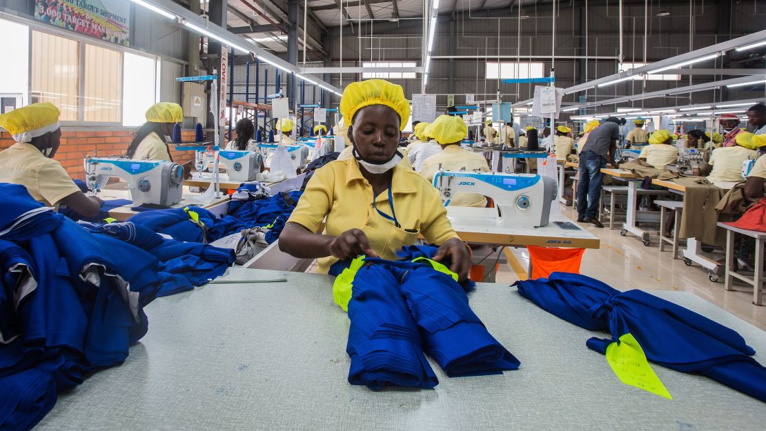 Workers in Rwanda's capital, Kigali, prepare polyester polo shirts.