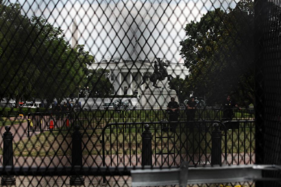 The White House is seen behind temporary metal fencing that was installed to keep protesters further back.