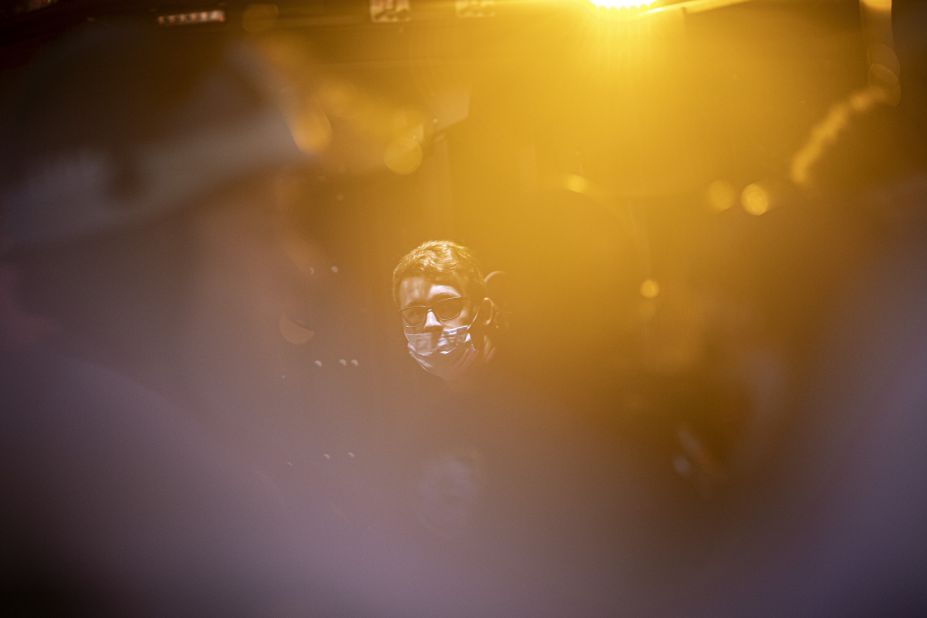 A protester who was arrested for breaking a curfew in New York looks out from a police van on June 4.