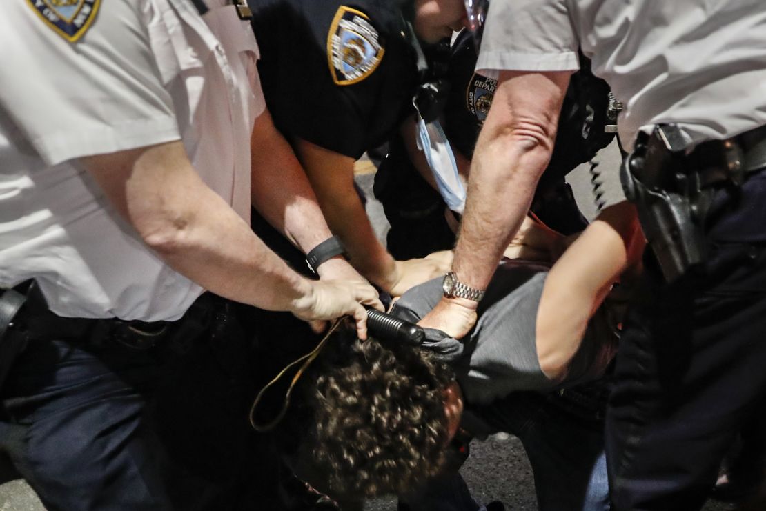 Police arrest a protester on Fifth Avenue during a march in Manhattan.