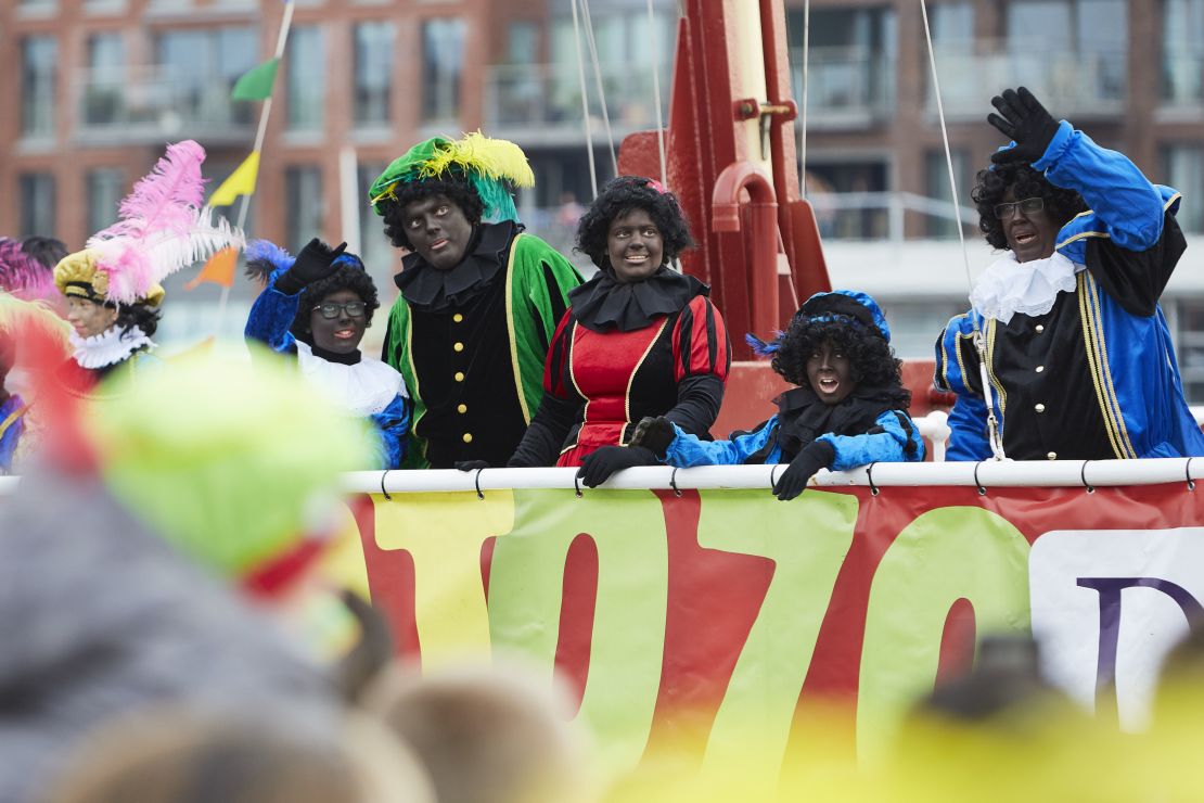 People dressed as Black Pete arrive by boat during the traditional St. Nicholas parade on November 16, 2019 in The Hague, Netherlands. 