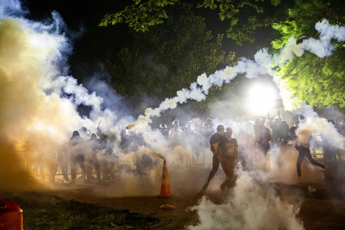 Tear gas rises above protesters during a demonstration outside the White House on Sunday.