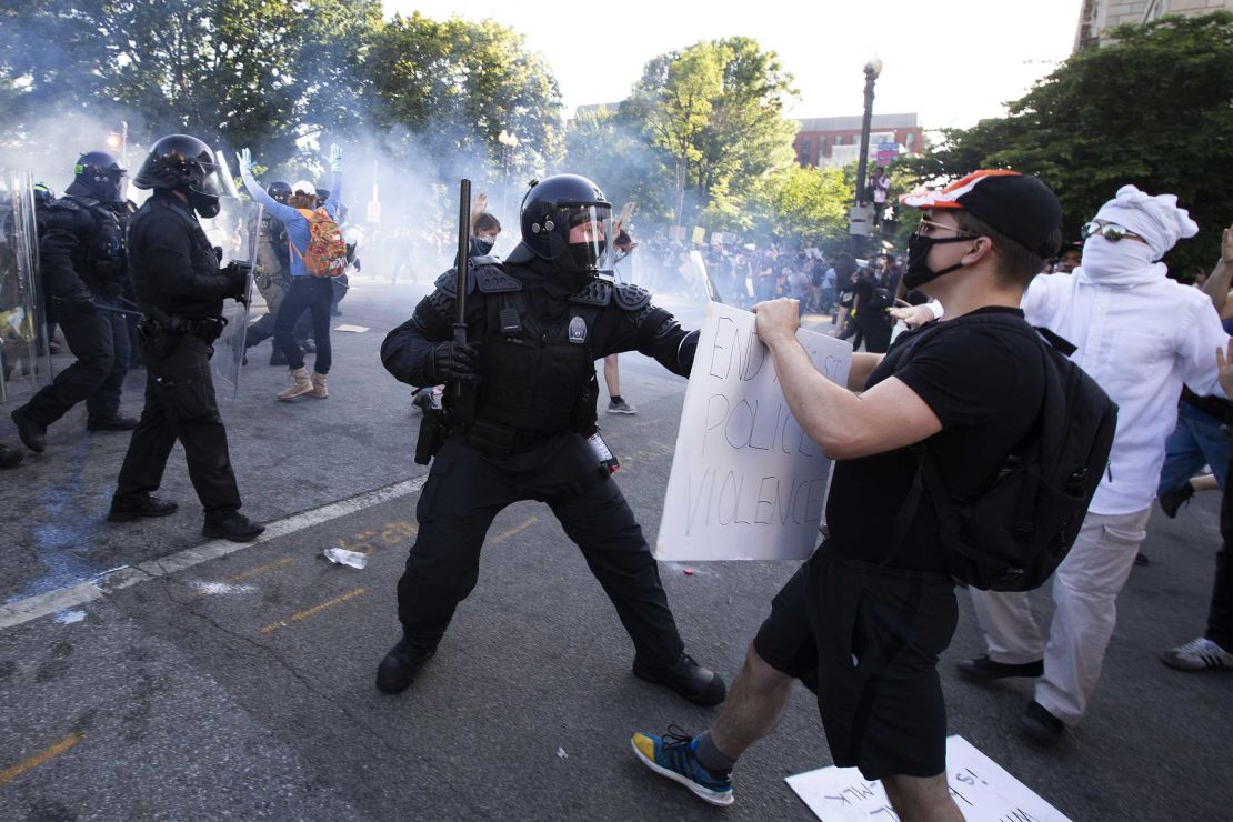 Police clash with protesters near the White House on Monday at a demonstration against the killing of George Floyd.