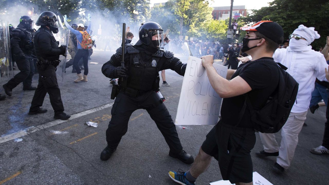 Police officers clash with protestors near the White House on June 1 as demonstrations against George Floyd's death continue.