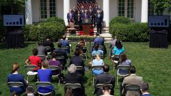 US President Donald Trump, with Director of the National Economic Council Larry Kudlow (L), holds a press conference on the economy, in the Rose Garden of the White House in Washington, DC, on June 5, 2020. - The US economy regained 2.5 million jobs in May as coronavirus pandemic shutdowns began to ease, sending the unemployment rate falling to 13.3 percent, the Labor Department reported on June 5. (Photo by MANDEL NGAN / AFP) (Photo by MANDEL NGAN/AFP via Getty Images)