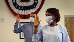 People are sworn in as new American citizens during a ceremony at the U.S. Citizenship and Immigration Service's Kendall office on June 4 in Miami, Florida. The ceremonies were shorter and other precautions were taken to limit any possible exposure to coronavirus for those in attendance. 