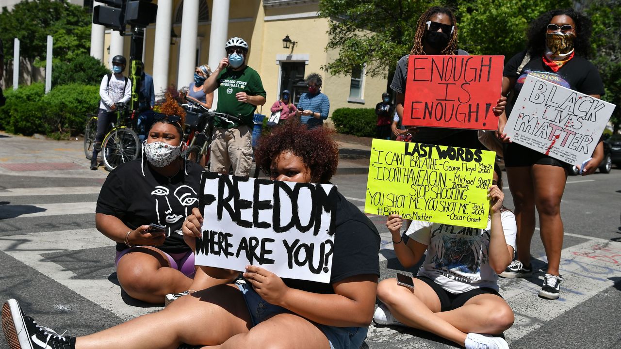 People protest the death of George Floyd outside Lafayette Square near the White House in Washington, DC on Monday (Photo by MANDEL NGAN/AFP via Getty Images)